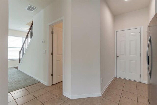 entrance foyer with light tile patterned floors