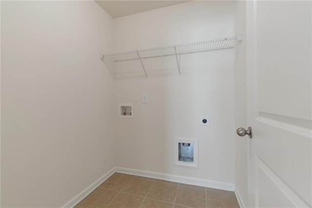 washroom with light tile patterned floors, hookup for a washing machine, and electric dryer hookup