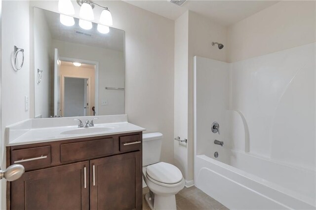 full bathroom with shower / bath combination, tile patterned floors, toilet, and vanity