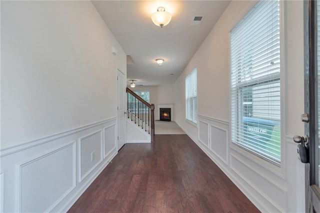 corridor featuring dark hardwood / wood-style flooring