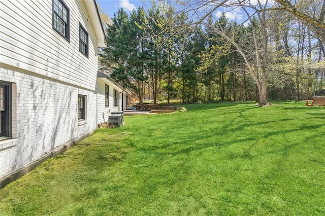 view of yard with central AC