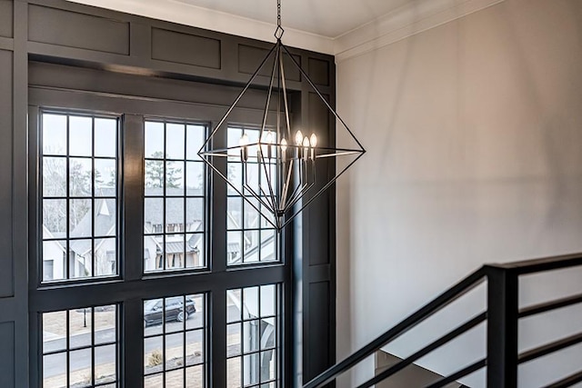 details with a chandelier and crown molding