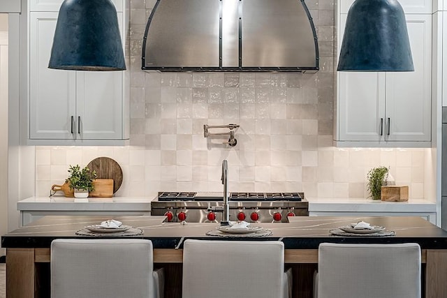 kitchen with backsplash and white cabinetry