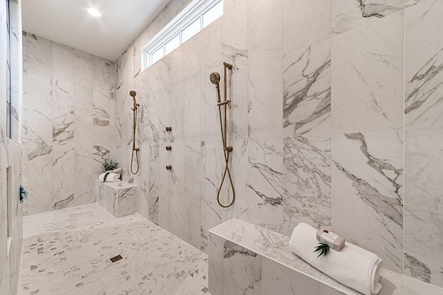 full bathroom with a marble finish shower