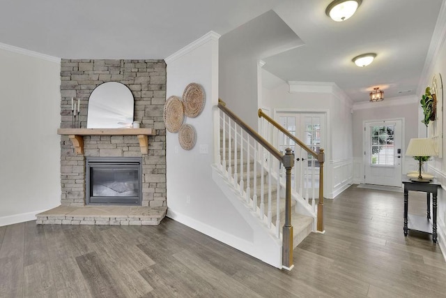 7190 Tributary Ct, Cumming, GA 30040 - entrance foyer with stairway, ornamental molding, wood finished floors, and a fireplace
