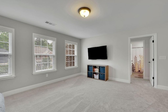 7190 Tributary Ct, Cumming, GA 30040 - unfurnished living room with carpet flooring, healthy amount of natural light, and baseboards