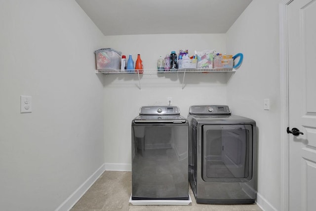 7190 Tributary Ct, Cumming, GA 30040 - laundry area with separate washer and dryer and baseboards