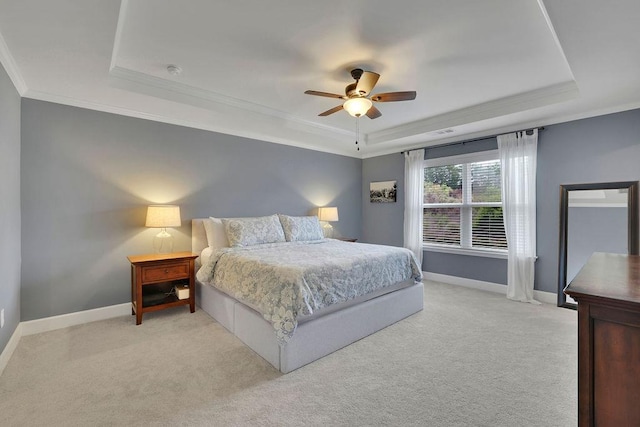 7190 Tributary Ct, Cumming, GA 30040 - bedroom featuring a tray ceiling, crown molding, baseboards, light colored carpet, and a ceiling fan