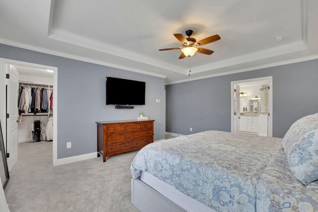 7190 Tributary Ct, Cumming, GA 30040 - bedroom with a tray ceiling, ornamental molding, light colored carpet, a spacious closet, and baseboards