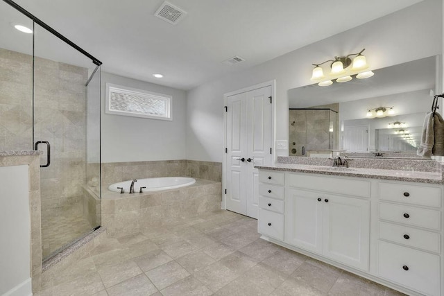 7190 Tributary Ct, Cumming, GA 30040 - full bath with a garden tub, a shower stall, and vanity