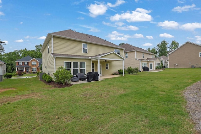 7190 Tributary Ct, Cumming, GA 30040 - rear view of property featuring a patio, a ceiling fan, a lawn, and an outdoor hangout area