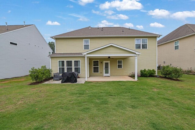 7190 Tributary Ct, Cumming, GA 30040 - back of property featuring a ceiling fan, a patio area, and a yard