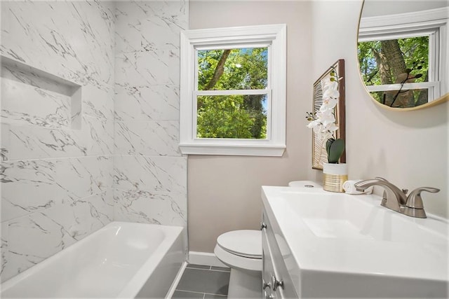 full bathroom with washtub / shower combination, toilet, vanity, and tile patterned flooring