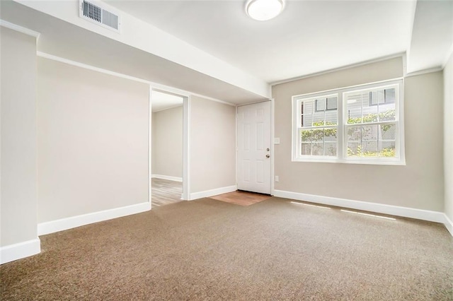 interior space with ornamental molding and carpet floors