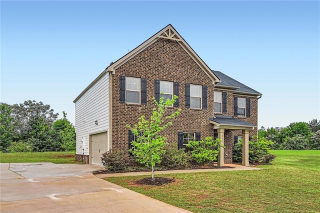 traditional-style house featuring brick siding, an attached garage, driveway, and a front yard