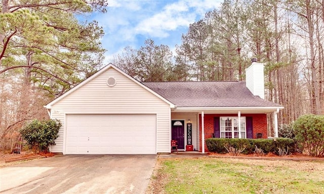 ranch-style home with a garage, a front yard, and covered porch