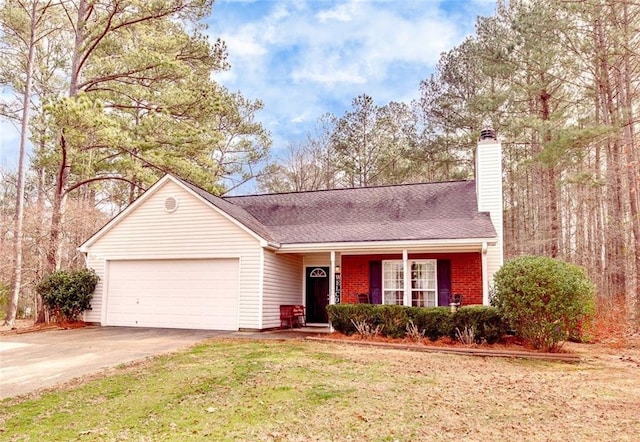 view of front of house with a garage and a front yard