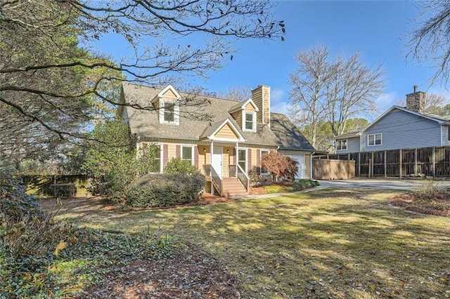 cape cod-style house featuring a garage, a front yard, fence, and a chimney