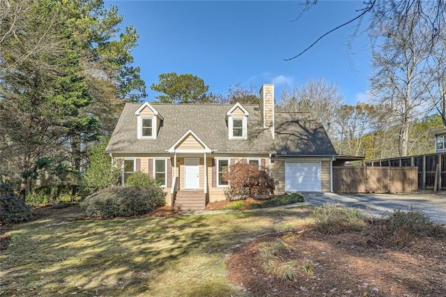 cape cod home with a garage, fence, driveway, a chimney, and a front yard