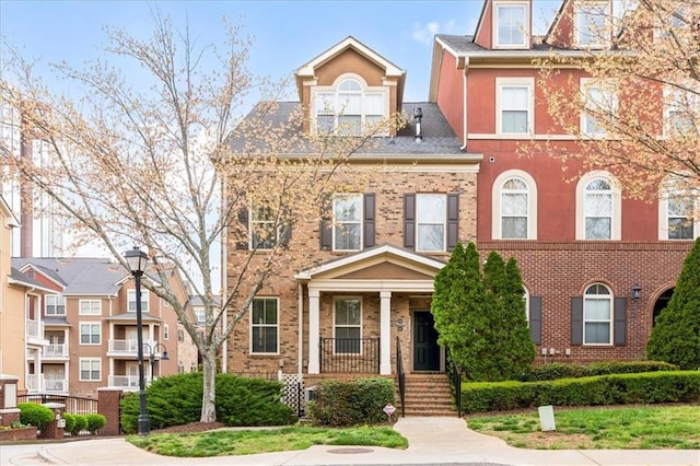 view of front of home featuring brick siding