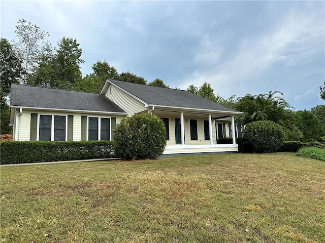 single story home with covered porch and a front lawn