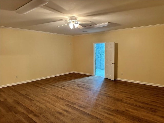 spare room featuring dark hardwood / wood-style floors, ceiling fan, and crown molding