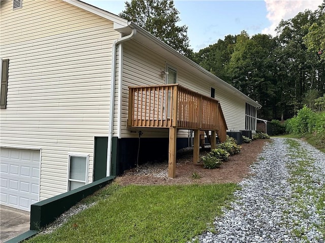 view of home's exterior featuring a deck and central air condition unit