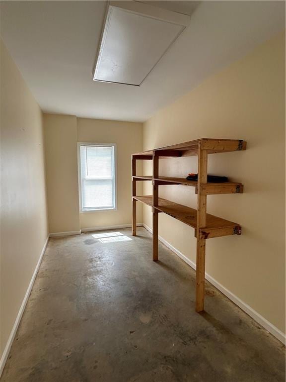 bonus room with concrete flooring