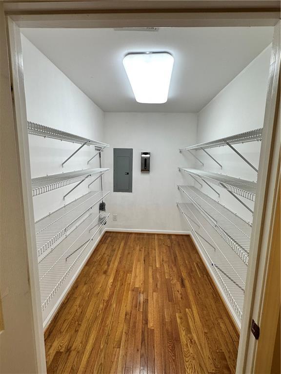 interior space with hardwood / wood-style flooring and electric panel