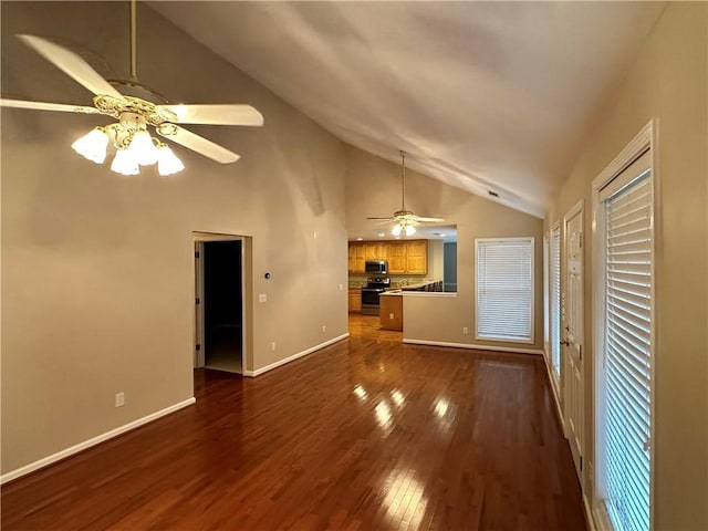 unfurnished living room featuring vaulted ceiling, ceiling fan, and dark hardwood / wood-style floors