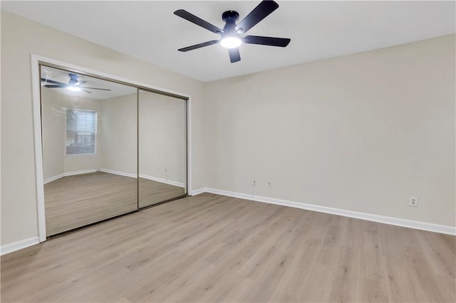 404 Hawkstone Way, Alpharetta, GA 30022 - unfurnished bedroom with light wood finished floors, a closet, and ceiling fan