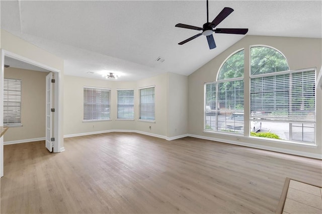 404 Hawkstone Way, Alpharetta, GA 30022 - unfurnished living room with ceiling fan, wood finished floors, and high vaulted ceiling