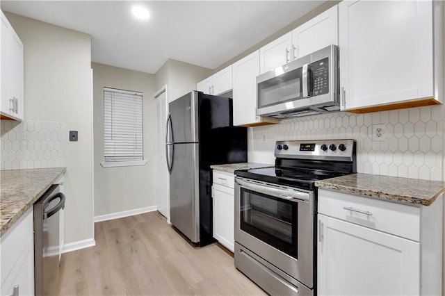 404 Hawkstone Way, Alpharetta, GA 30022 - kitchen with appliances with stainless steel finishes, light wood finished floors, white cabinetry, backsplash, and recessed lighting