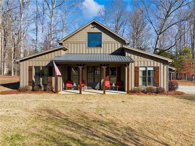 view of front of home featuring a front lawn and board and batten siding