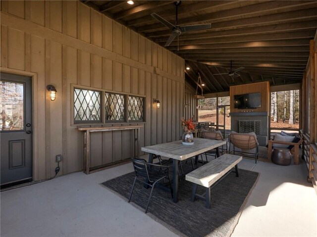 view of patio with ceiling fan and outdoor dining space