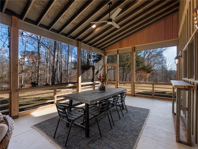 sunroom / solarium with lofted ceiling and ceiling fan