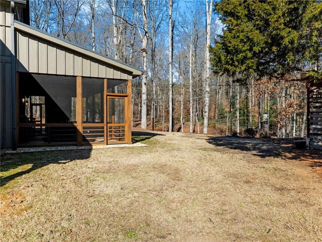 view of yard with a sunroom