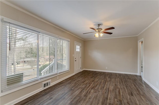 unfurnished room featuring crown molding, dark wood-type flooring, and ceiling fan