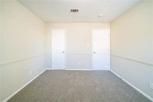 1129 Winston Dr, Decatur, GA 30032 - carpeted empty room featuring a textured ceiling
