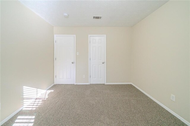 1129 Winston Dr, Decatur, GA 30032 - unfurnished room featuring a textured ceiling and carpet flooring