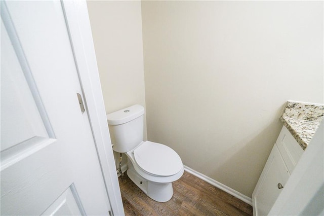 1129 Winston Dr, Decatur, GA 30032 - bathroom featuring toilet, vanity, and hardwood / wood-style flooring