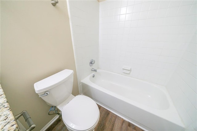 1129 Winston Dr, Decatur, GA 30032 - bathroom with toilet, tiled shower / bath combo, and wood-type flooring