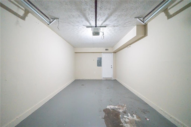 1129 Winston Dr, Decatur, GA 30032 - garage featuring a garage door opener and electric panel