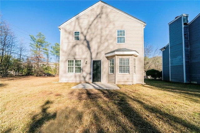 1129 Winston Dr, Decatur, GA 30032 - back of house featuring a patio area and a lawn