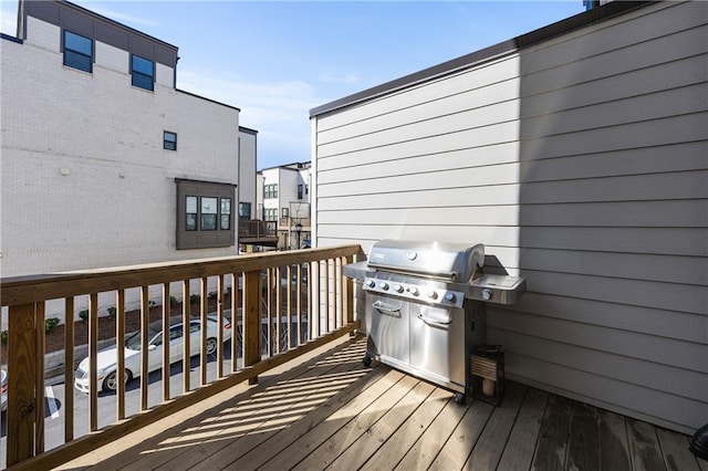 wooden terrace featuring grilling area