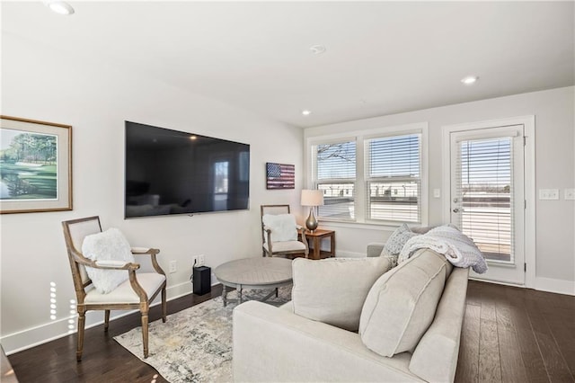 living room featuring recessed lighting, dark wood finished floors, and baseboards