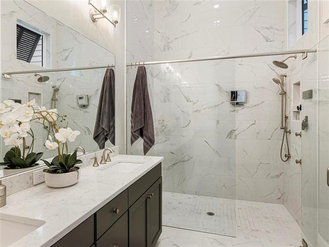 bathroom featuring vanity and tiled shower