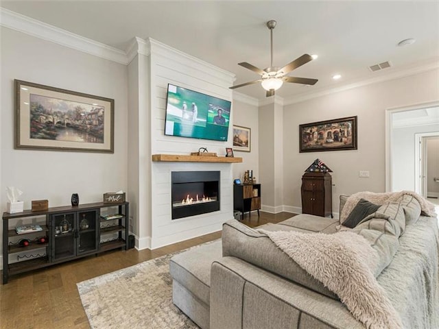 living room featuring a fireplace, dark wood-type flooring, ceiling fan, and ornamental molding