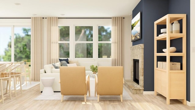 2447 Livi Ln, Buford, GA 30519 - living area with a glass covered fireplace and wood finished floors