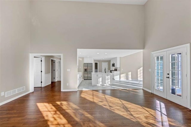 3017 Lana Ln, Marietta, GA 30066 - entryway with french doors, a towering ceiling, light wood-style flooring, and baseboards